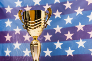 Photo of award superimposed over an american flag
